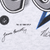 Close-up of NFL logo, 1996 NFLP copyright text, and printed signatures on grey fabric