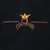 Close-up of gold and red Los Guerreros crown crest on the front
