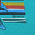Close-up of striped print detail and ©85 Lifestyles mark on teal fabric