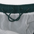Interior waistband detail with green drawstring and white mesh brief lining