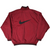 Back of burgundy Nike pullover jacket with large black Swoosh graphic