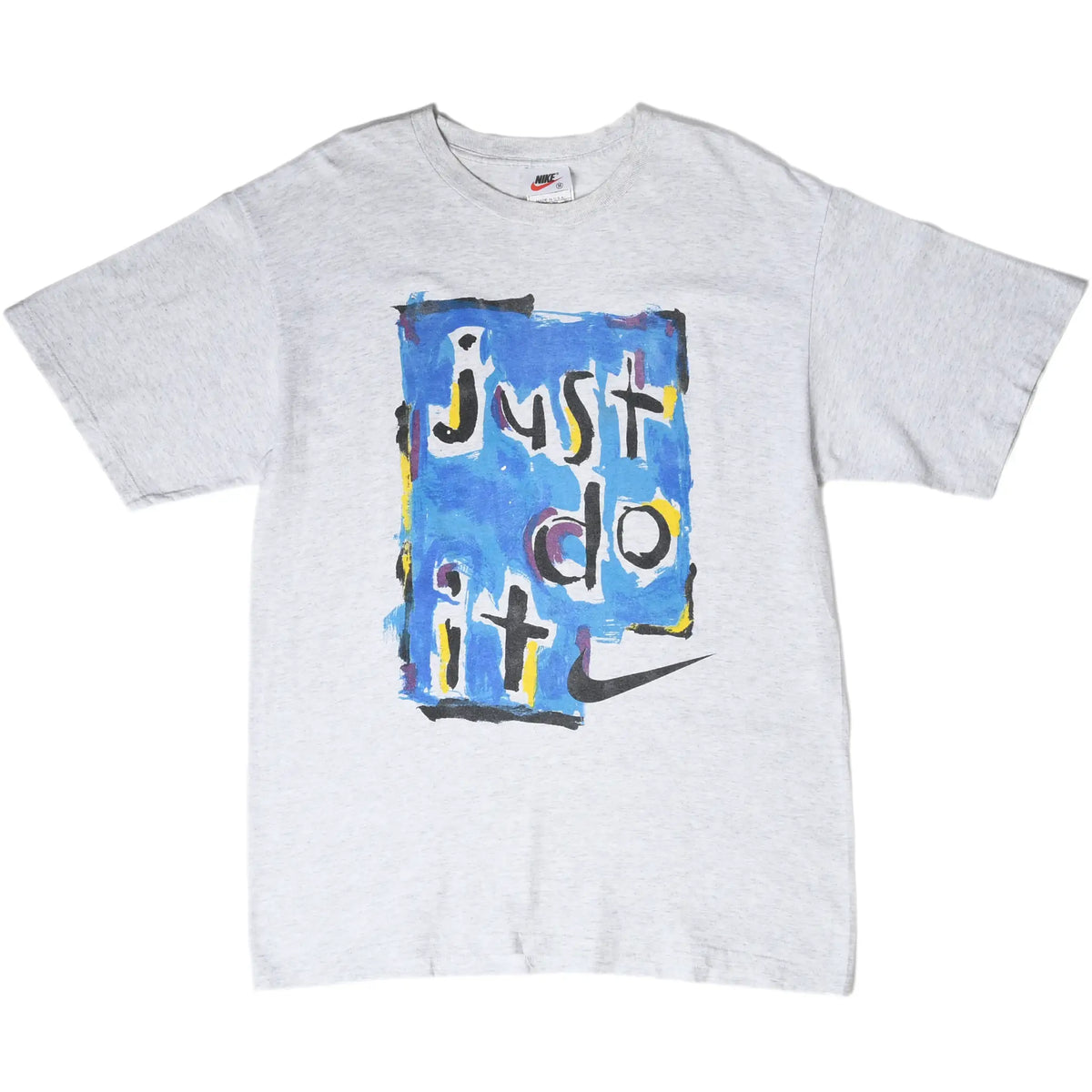 Front of grey Nike T-shirt with blue painted Just Do It graphic and black Swoosh