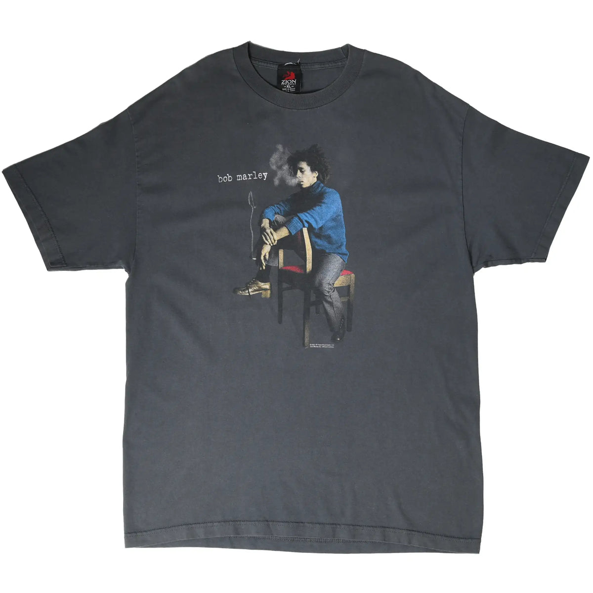Full front of grey Bob Marley T-shirt featuring a seated portrait in a blue shirt