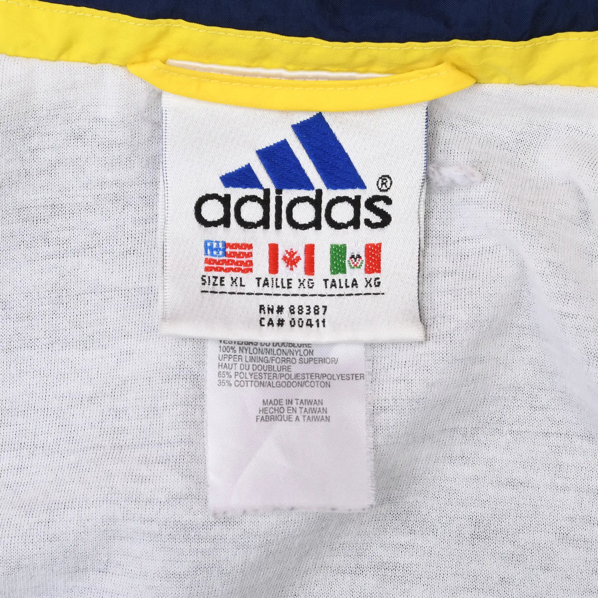 Adidas jacket neck and care labels showing size XL and product codes