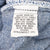 Interior care label on Levi's 501 jeans with washing instructions