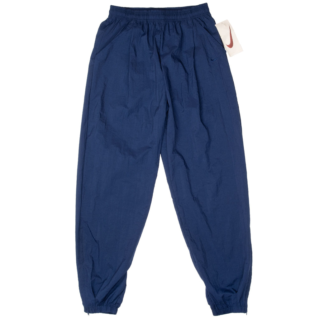 VINTAGE NIKE CLASSIC SWOOSH BLUE NYLON TRACK PANTS 1990S LARGE DEADSTOCK