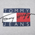 Close-up of Tommy Jeans chest graphic in navy, white, red and black on grey fabric