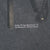 Close-up of small 2001 Bob Marley licensing copyright text printed on grey fabric
