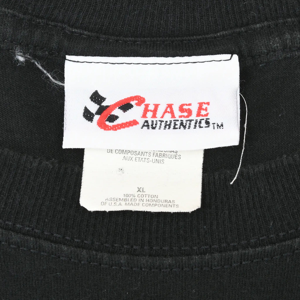 Close-up of Chase Authentics neck label on black T-shirt