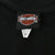 Close-up of Harley-Davidson Motor Cycles neck tag on black T-shirt