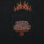 Close-up of black chest pocket with Harley-Davidson Motorcycles print and orange flames