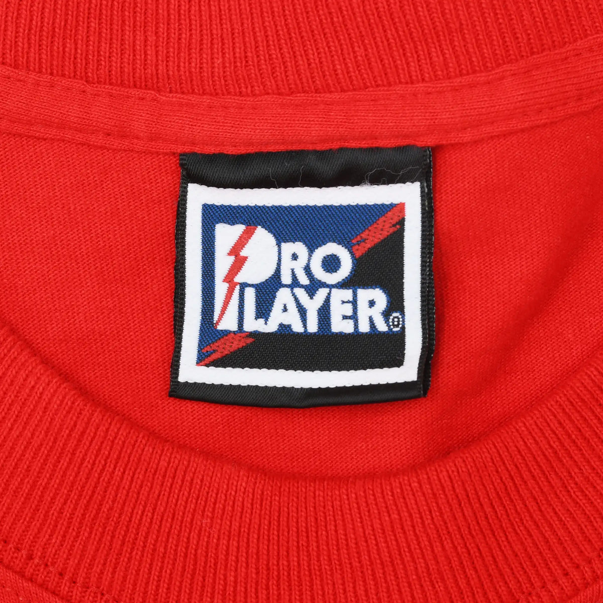 Close-up of Pro Player neck label inside the red T-shirt collar