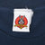 Close-up of Looney Tunes Bugs Bunny neck tag on navy T-shirt