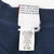 Reverse neck and care labels showing Warner Bros. copyright, fabric blend, size 18/20W, and USA manufacture
