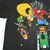Back print detail showing Yosemite Sam and Marvin the Martian riding motorcycles
