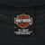 Harley-Davidson neck label showing XL, 100% cotton, and care information