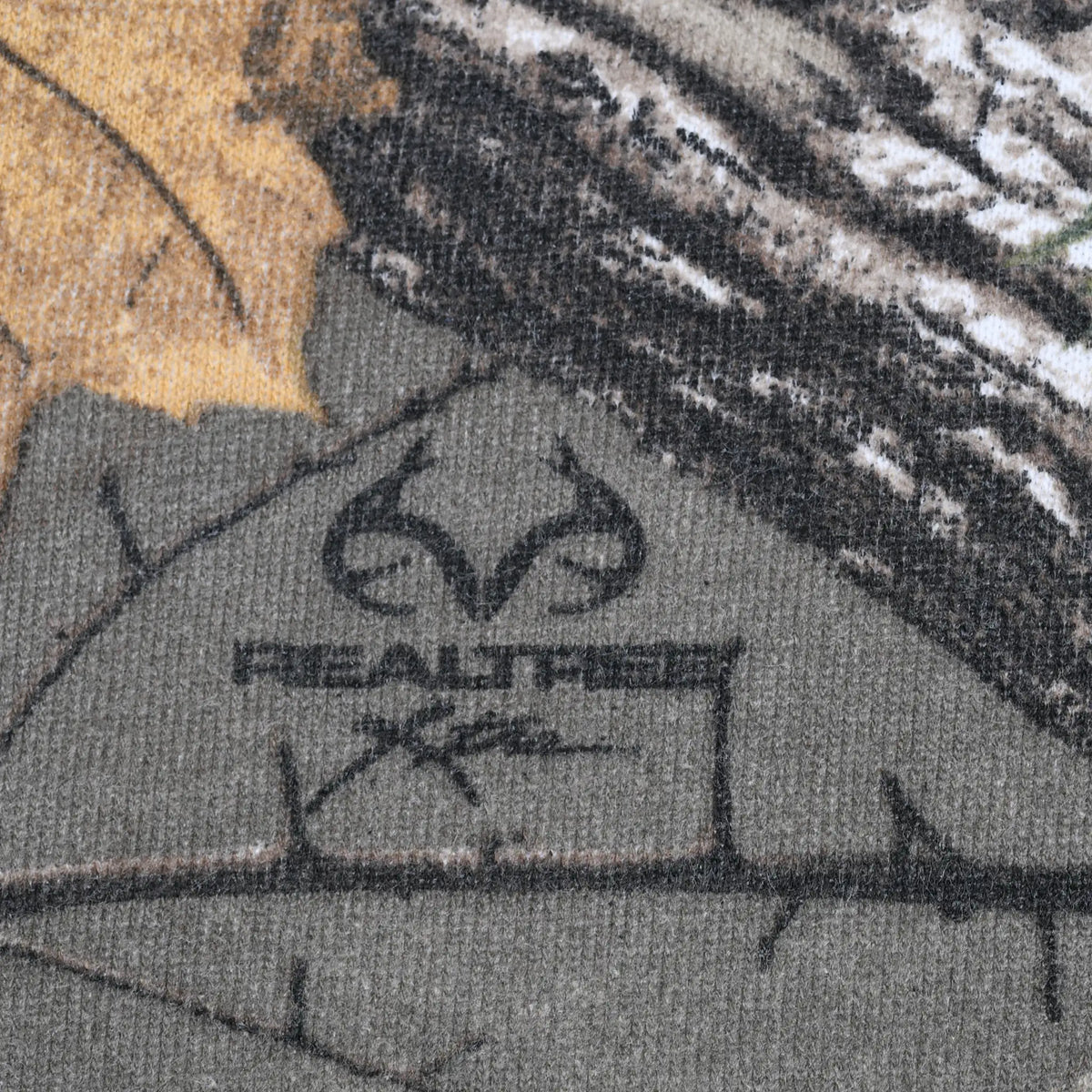 Close-up of Realtree logo printed within the camouflage pattern