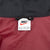 Nike neck label showing size XL inside burgundy windbreaker