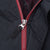 Close-up of burgundy front zipper and Nike Swoosh pull tab