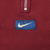 Close-up of white Nike Swoosh on blue center chest patch