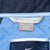 Nike windbreaker interior neck labels showing XXL sizing