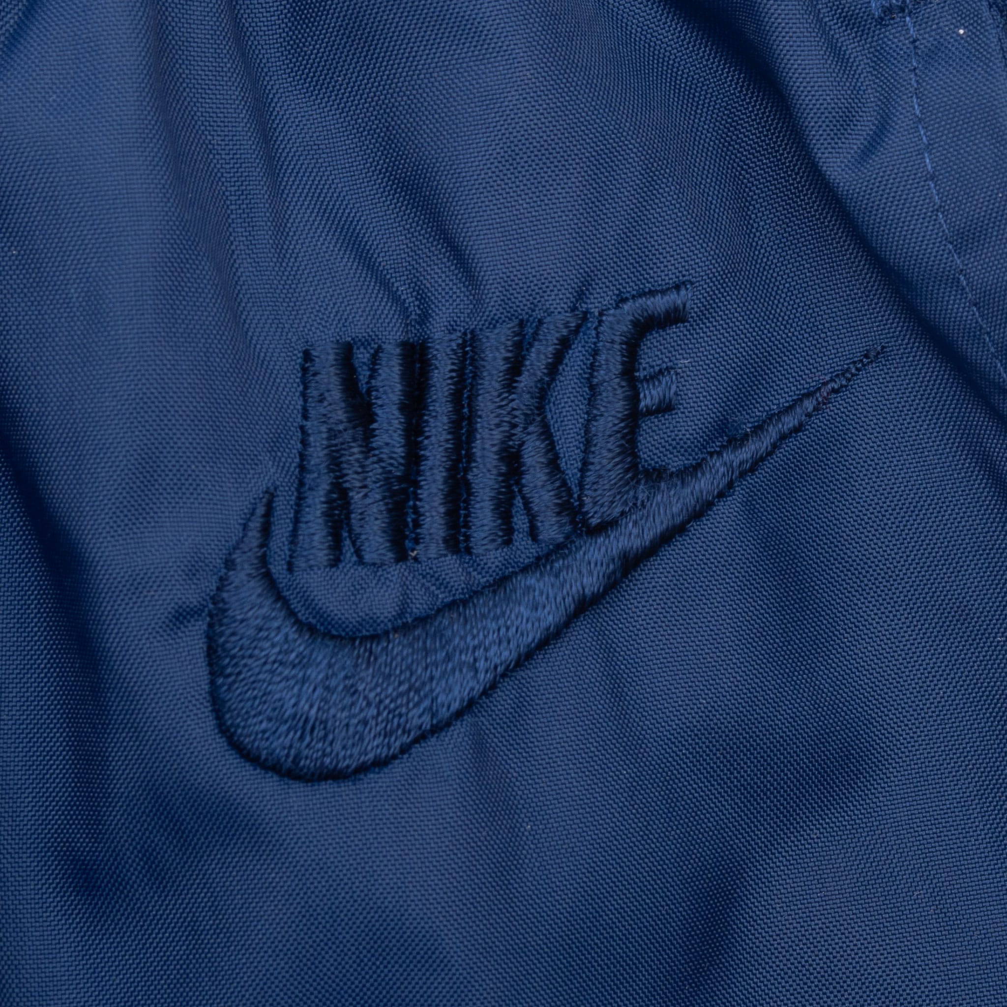 VINTAGE NIKE SWOOSH NAVY BLUE TRACK PANTS LATE 1980S SIZE LARGE