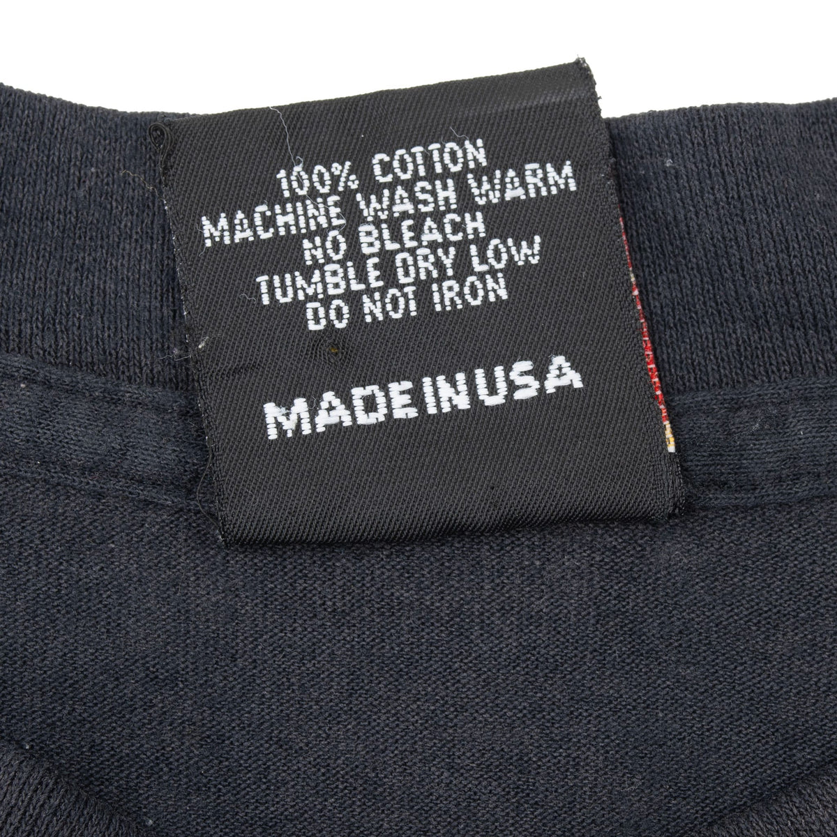 Close-up of care label with washing instructions and Made in USA text
