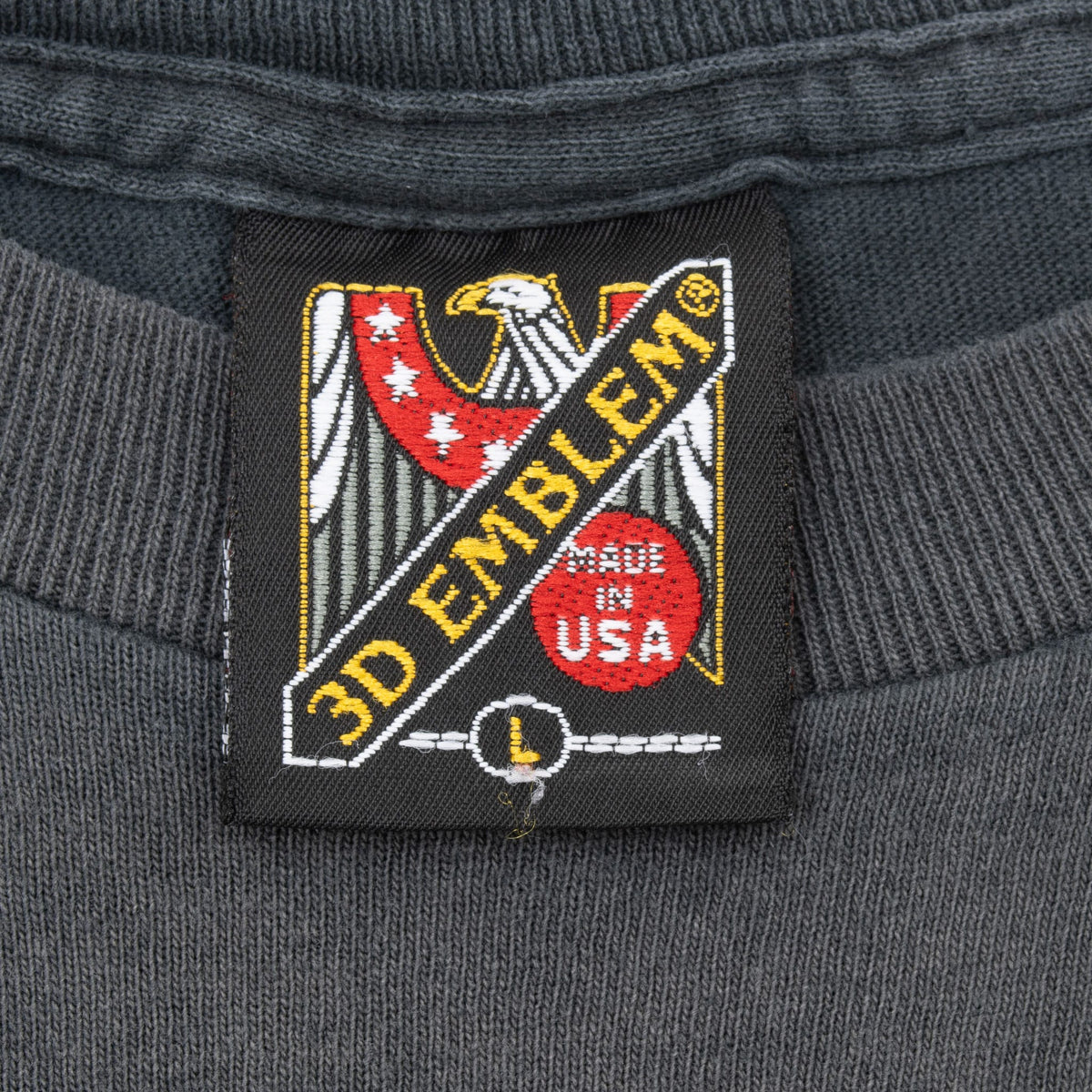 Close-up of 3D Emblem eagle neck tag with Made in USA marking