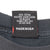 Close-up of care label stating 100% cotton and Made in USA