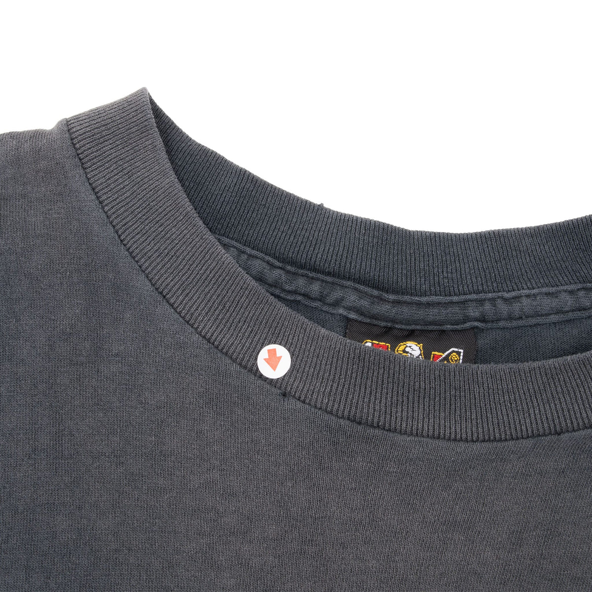 Close-up of black ribbed crew neck collar and interior seam