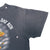 Close-up of back sleeve and underarm seams on black biker T-shirt