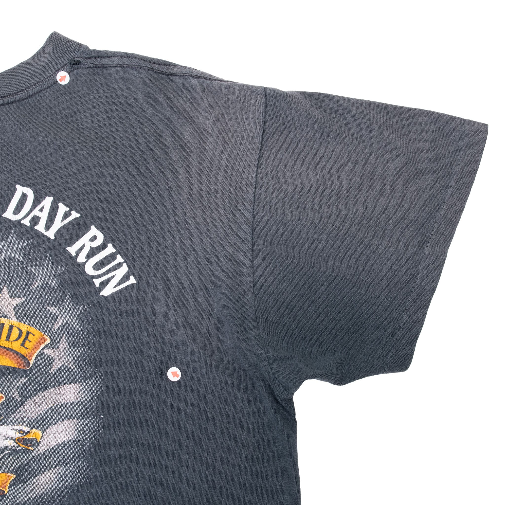 Close-up of back sleeve and underarm seams on black biker T-shirt