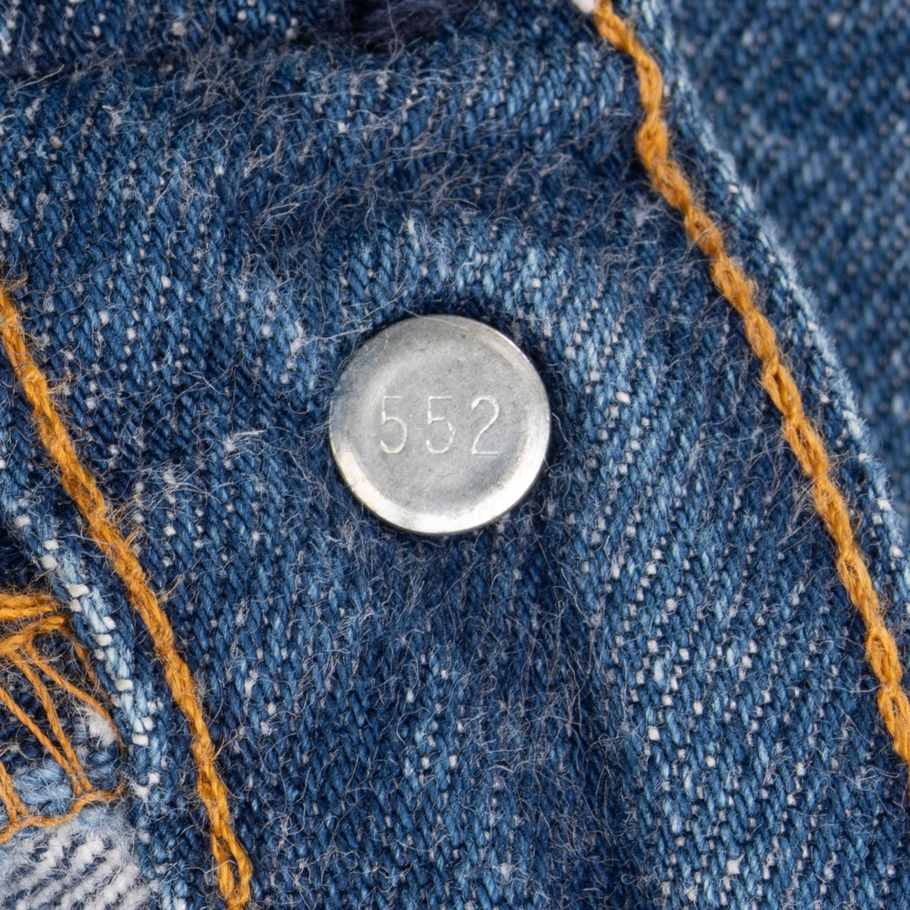 Reverse of the Levi’s waistband button stamped 552