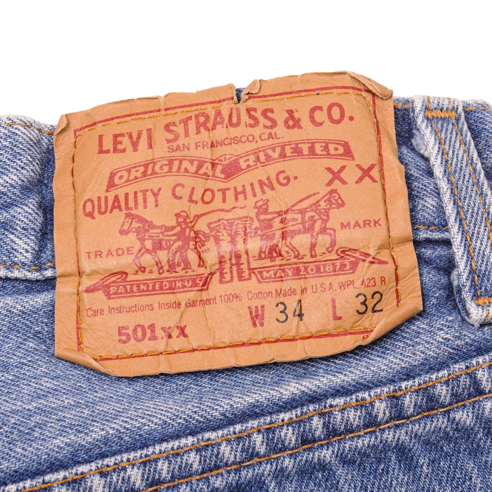 Beautiful Indigo Levis 501 Jeans Made in USA with a medium blue wash, some nice contrast between light and medium blue and some light whiskers.  Size on Tag 34X32  ACTUAL SIZE 32X28  Back Button #546