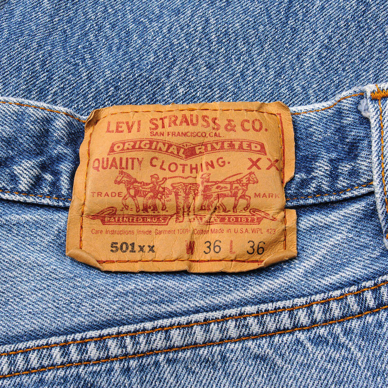 Beautiful Indigo Levis 501 Jeans Made in USA with a light blue wash, some nice whiskers and a nice contrast of light and medium blue.  Size 32x31  Back Button #5