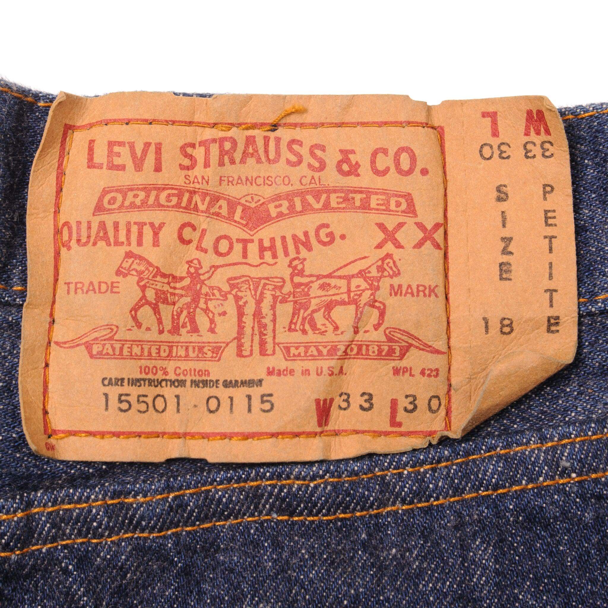 Beautiful Indigo Levis 501 Womenswear Jeans 1980's Made in USA with a very dark wash, deadstock with original tags.  Size on Tag 33X30