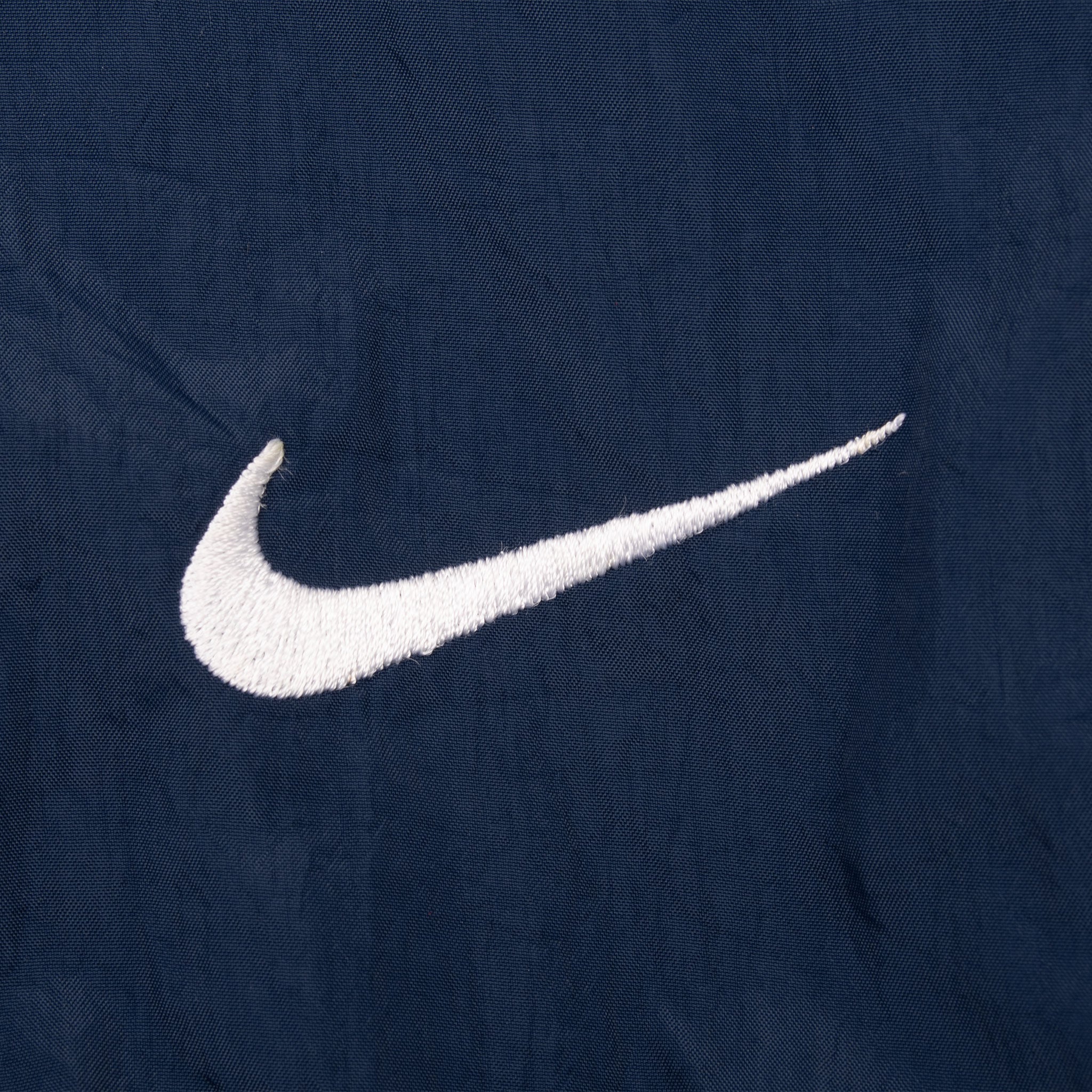VINTAGE NIKE CLASSIC SWOOSH BLUE WINDBREAKER JACKET 1990S 2XL