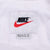 Nike neck label and women's XL size tag inside white windbreaker
