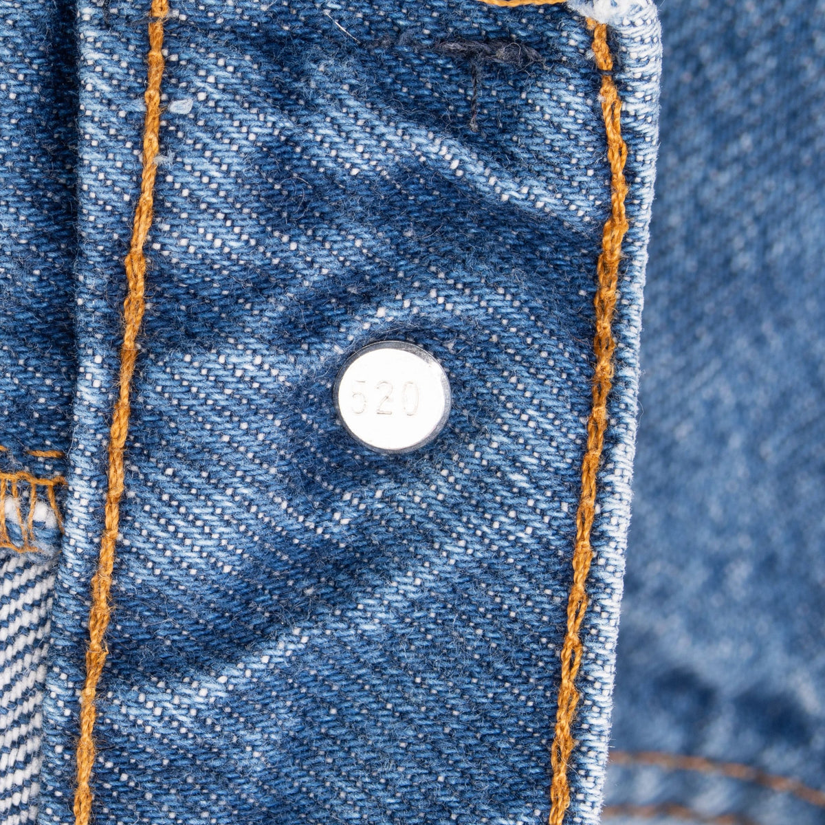 Close-up of the interior Levi's waistband button stamped 520