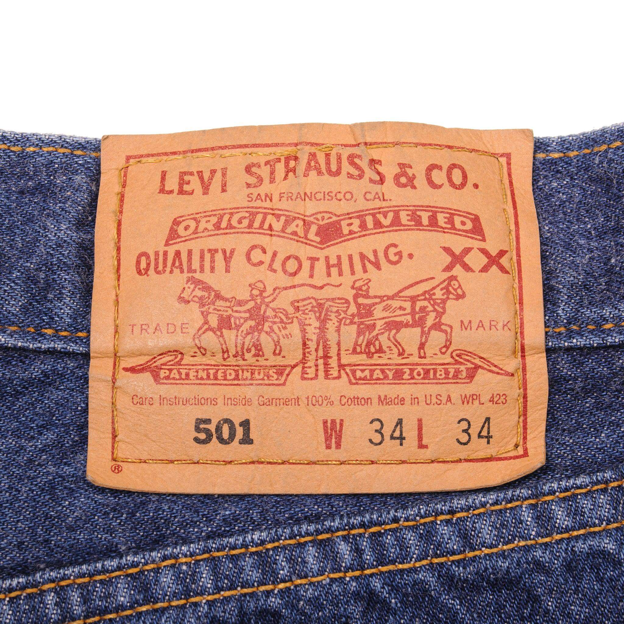 Beautiful Indigo Levis 501 Jeans 1990's Made in USA with a very dark wash.  Size on Tag 34X34  ACTUAL SIZE 33X33  Back Button #511