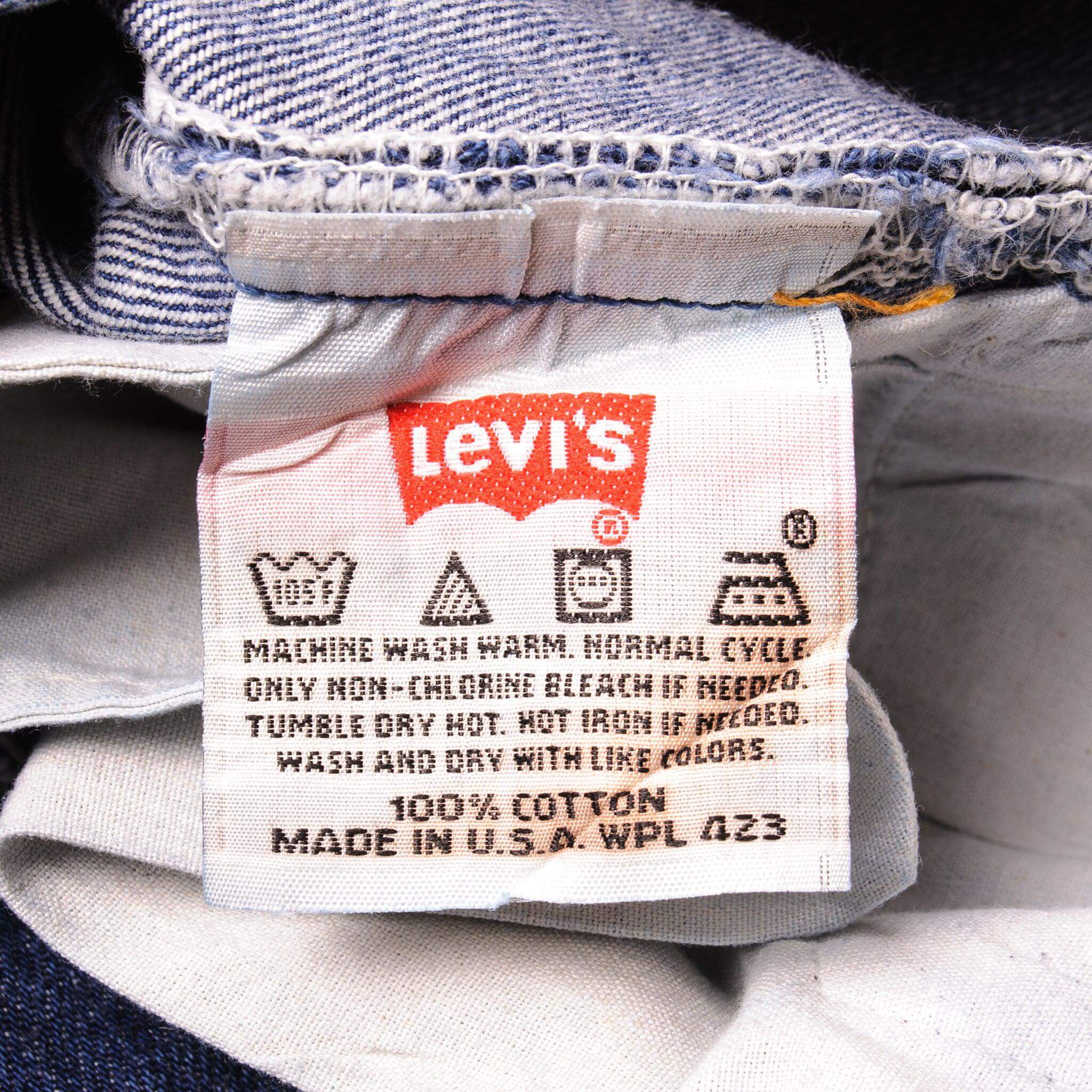 Beautiful Indigo Levis 501 Jeans 1990's Made in USA with a very dark wash.  Size on Tag 34X34  ACTUAL SIZE 33X34  Back Button #544