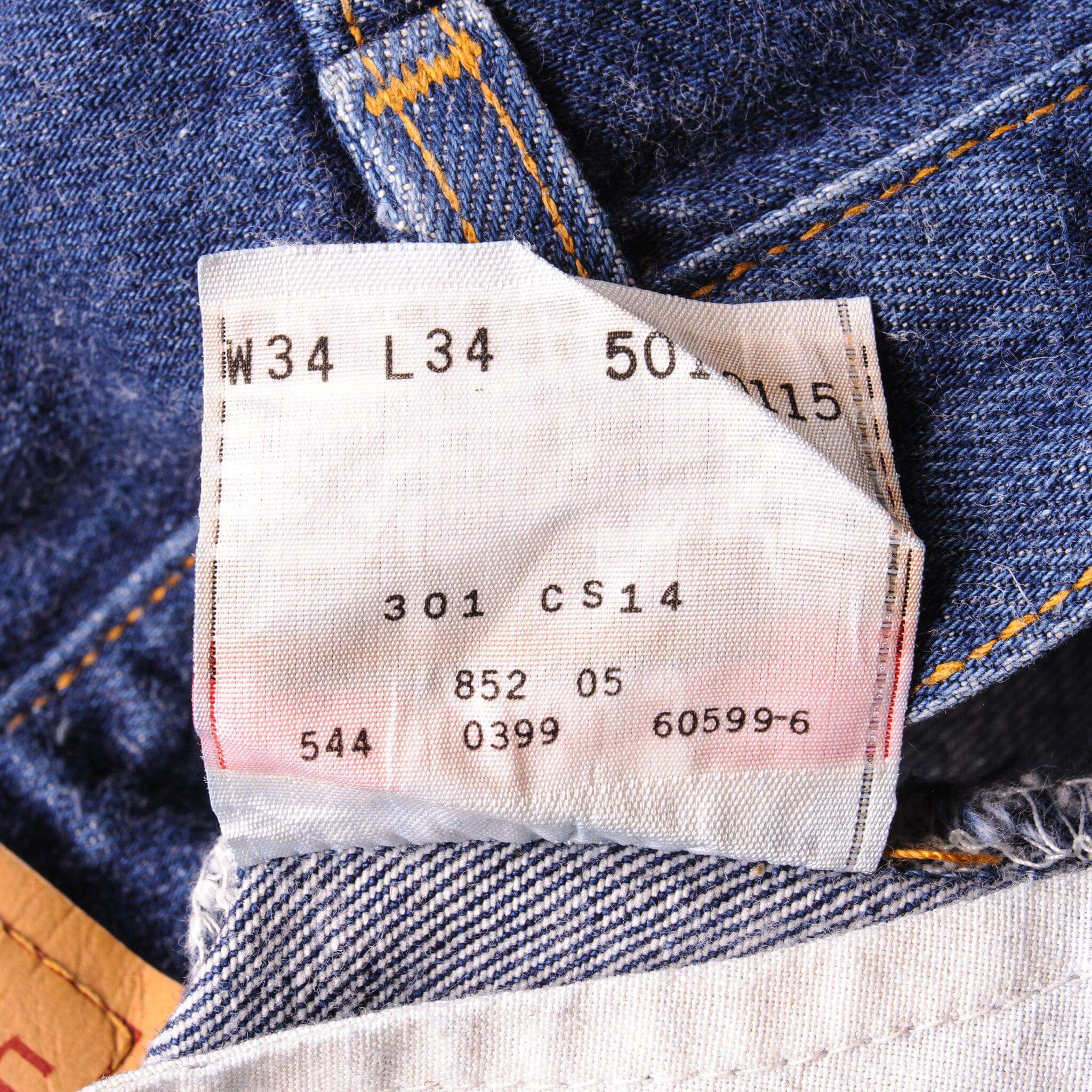 Beautiful Indigo Levis 501 Jeans 1990's Made in USA with a very dark wash.  Size on Tag 34X34  ACTUAL SIZE 33X34  Back Button #544