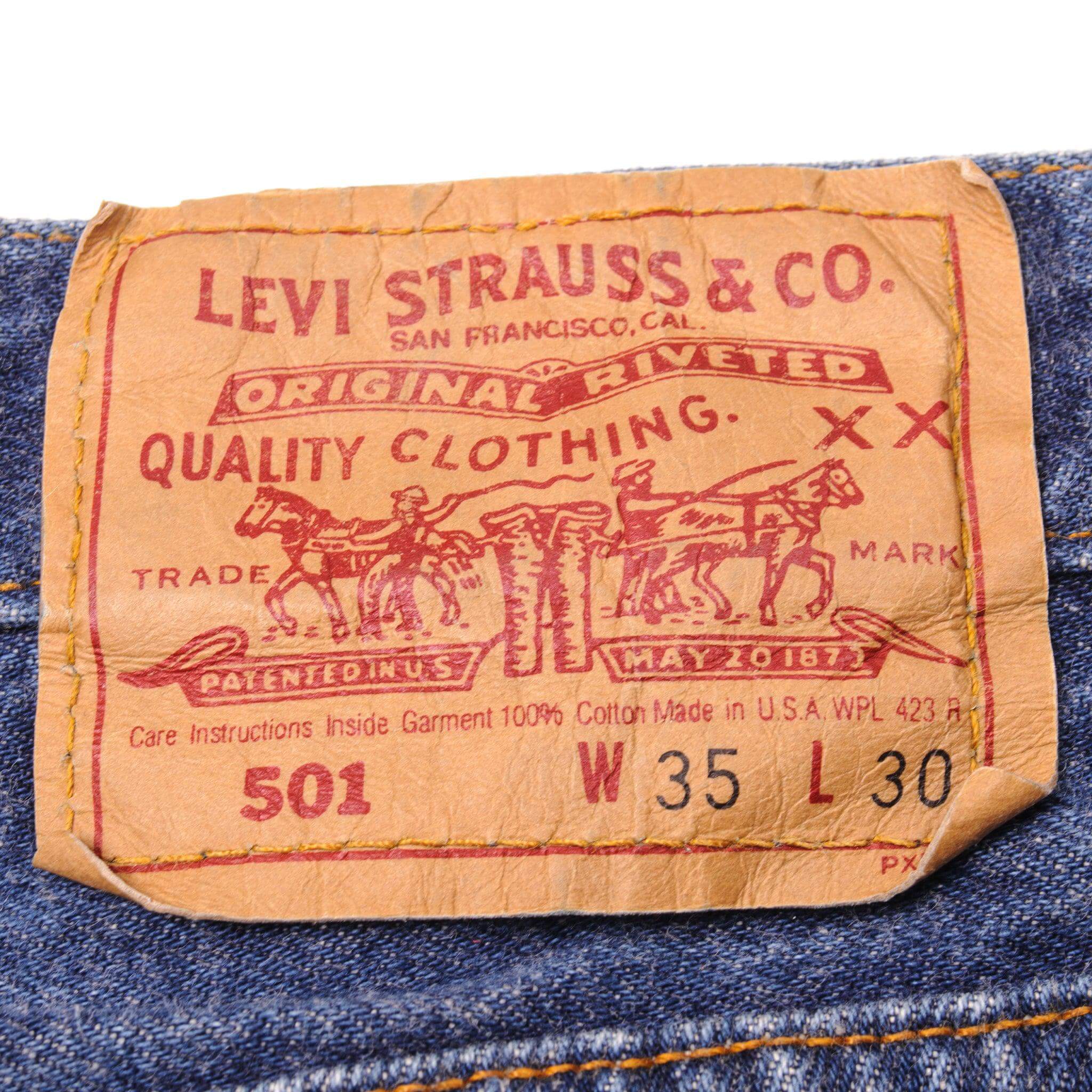 Beautiful Indigo Levis 501 Jeans 1990's Made in USA with a dark wash.  Size on Tag 35X30  ACTUAL SIZE 33X29  Back Button #553
