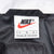VINTAGE NIKE SWOOSH BLACK WHITE AND YELLOW WINDBREAKER JACKET 1990S LARGE