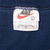 Nike neck tag showing size large and Made in USA text