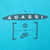 Upper-back Agassi and Nike graphic printed in black on turquoise fabric