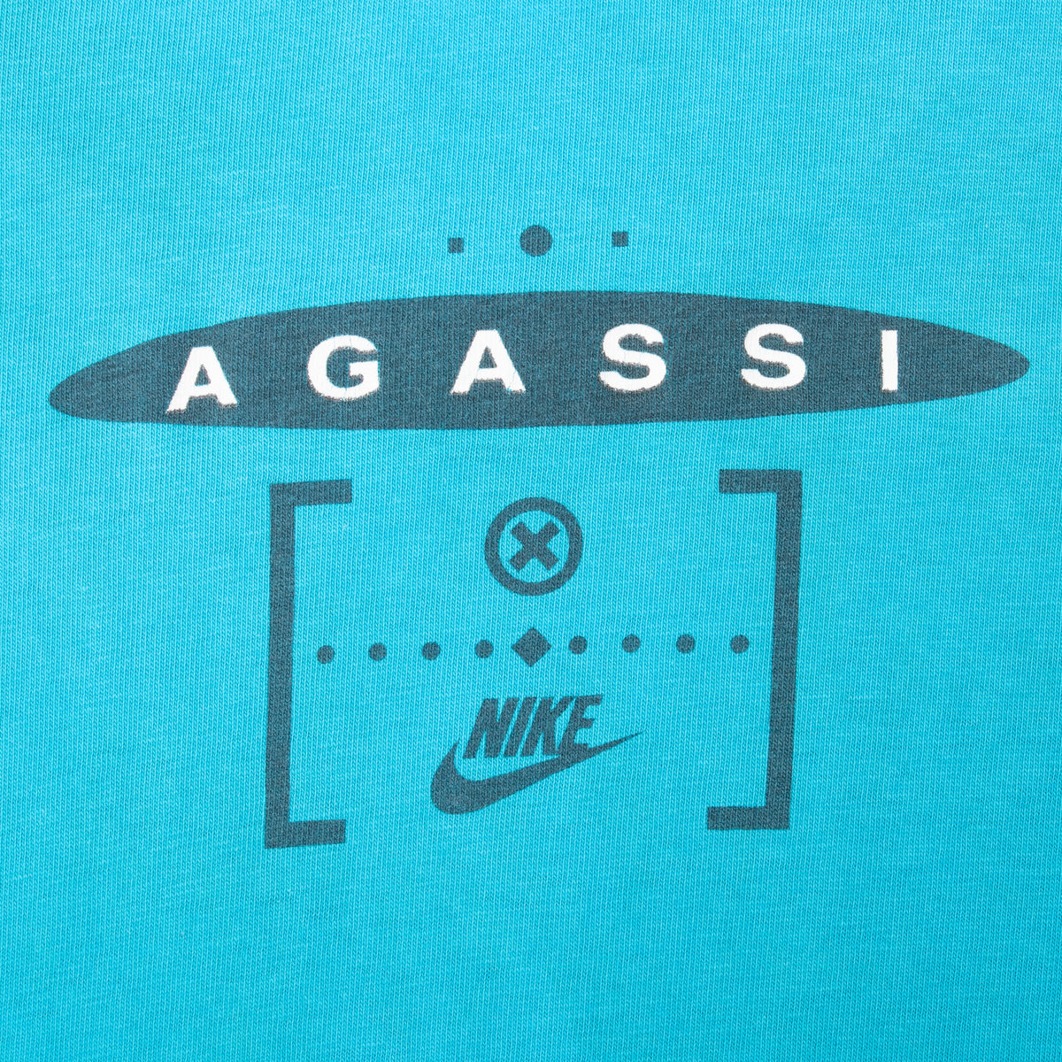 Upper-back Agassi and Nike graphic printed in black on turquoise fabric