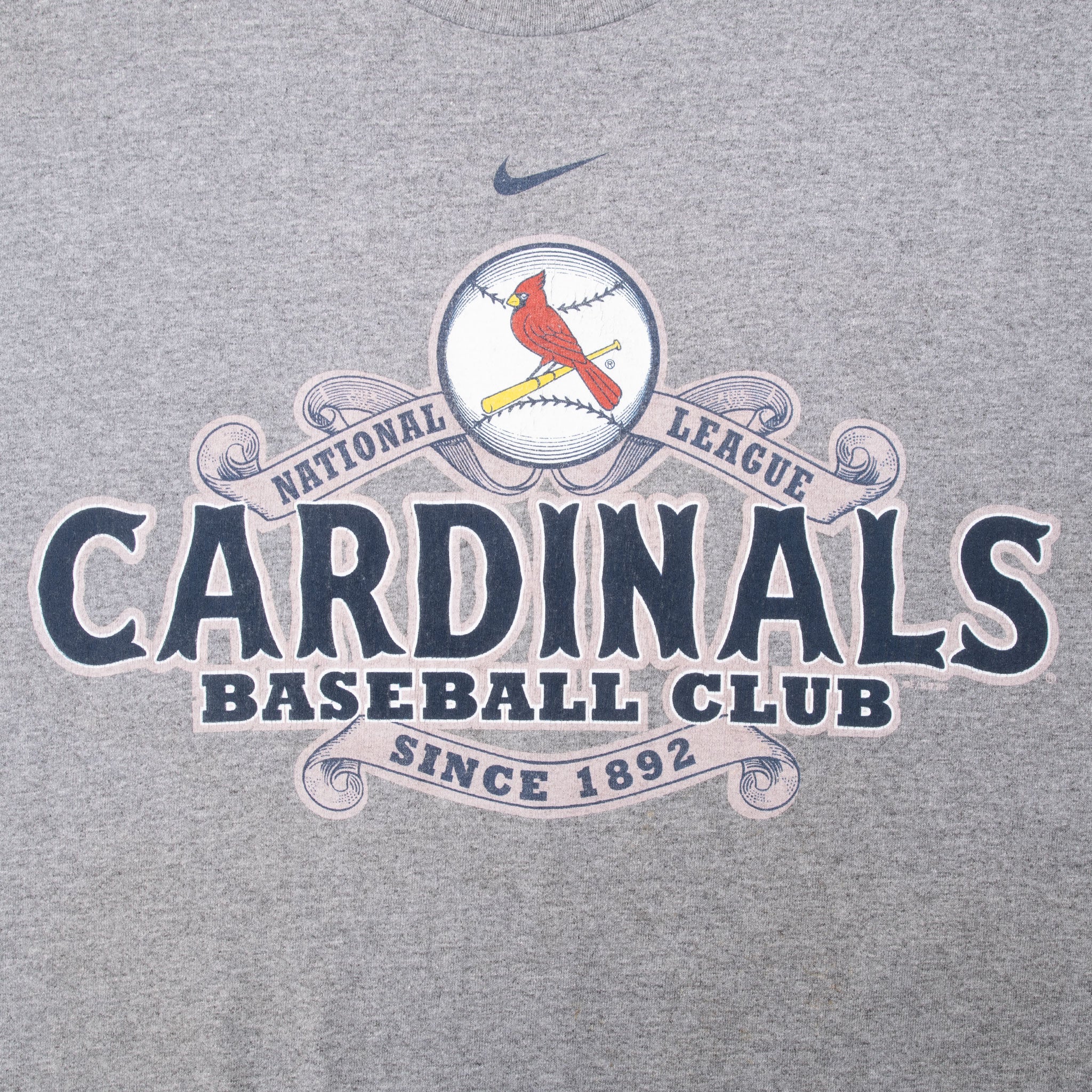 Close-up of Nike Swoosh and St. Louis Cardinals Baseball Club front graphic
