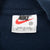 Nike neck tag showing medium size and Made in U.S.A.