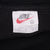 Nike neck tag showing Swoosh logo, XL size and Made in USA text